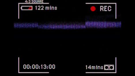 animation of blue and pink flashes of interference on black video playback interface screen