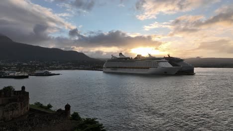 Two-Cruise-ships-at-Puerto-Plata-port-at-sunset,-aerial-drone-view