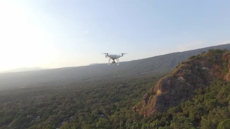 recreation drone flying above rocky tropical mountains in mexico