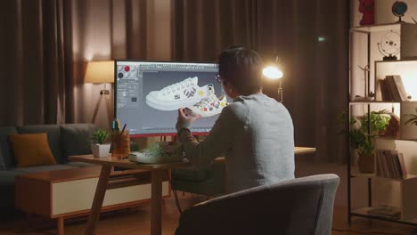 designer working on shoe design at night