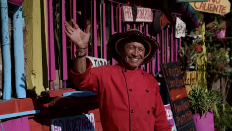 Happy-man-waving-his-hand-outdoors