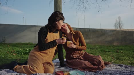 two women having a picnic in the park