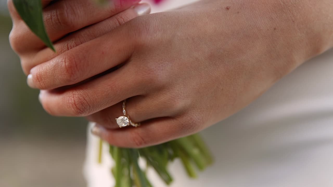 Close Up of Wedding Ring on Bride's Finger at Outdoor Wedding