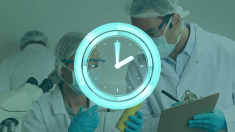 animation of moving clock over caucasian male and female scientist in lab