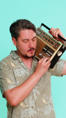 man holds vintage cassette player on shoulder dancing energetically enjoying retro music experience