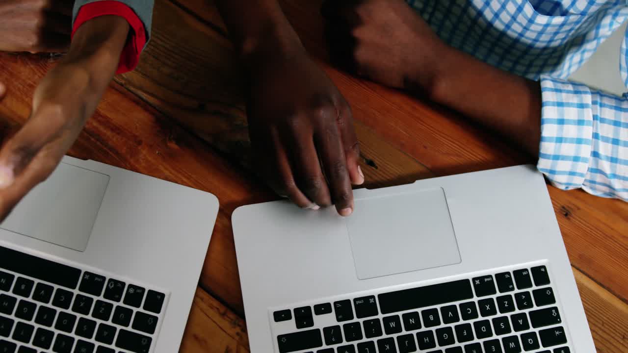 Man and woman using a laptop