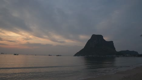 A-4K-time-lapse-of-the-sun-rising-over-Ao-Now,-Prachuab-Khiri-Khan,-Thailand