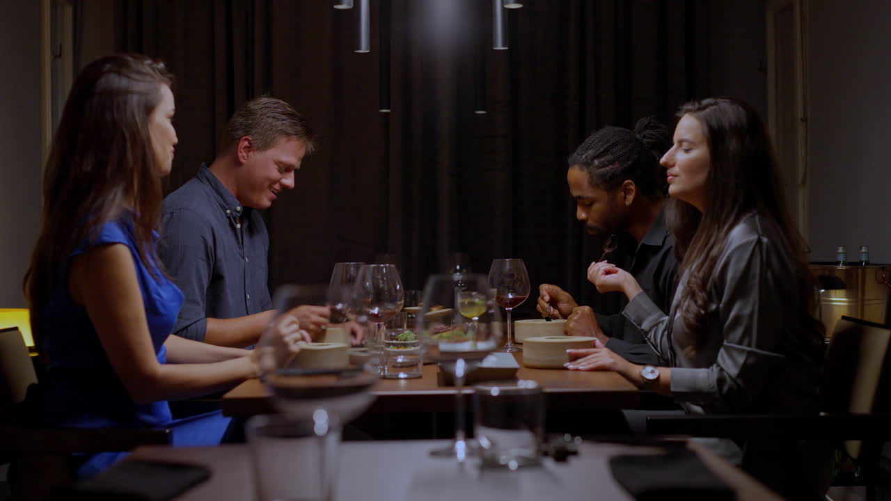 People Enjoying Dinner at a Restaurant