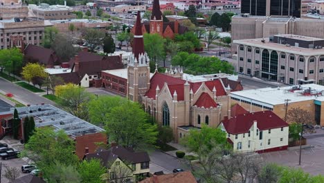 drone establishing angled view of rear side of cathedral church in pueblo colorado