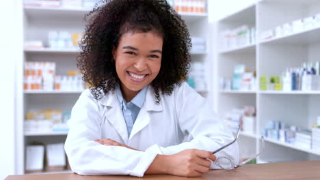 portrait of a young pharmacist removing glasses