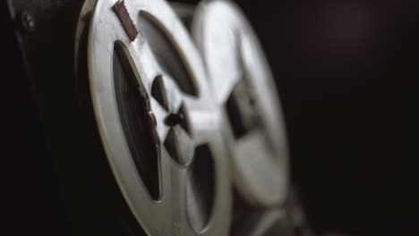reel film tape is rotating at a vintage professional player. oldschool equipment