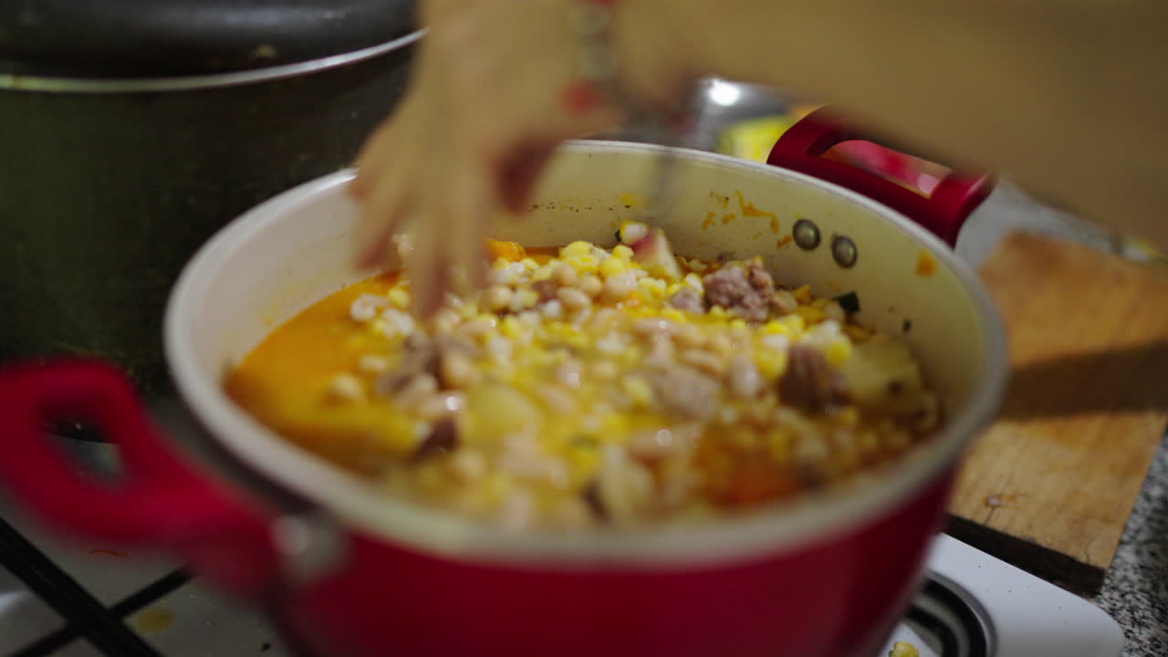 Argentinian Locro Stew Being Prepared in Rustic Home Kitchen, Traditional Food Culture