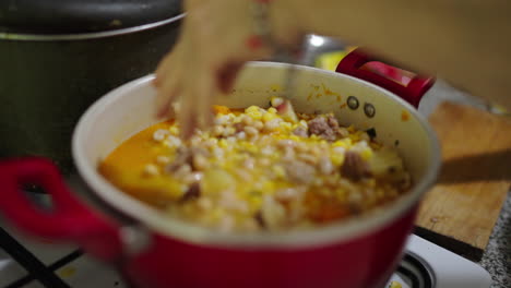 argentinian locro stew being prepared in rustic home kitchen, traditional food culture