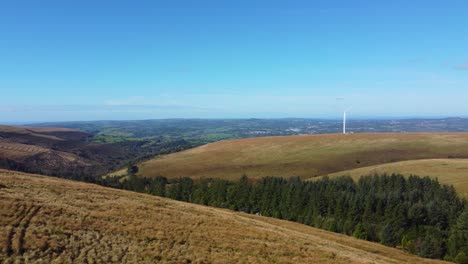 aerial view of wind turbine on a hilltop