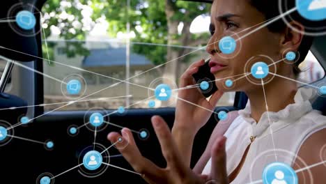 Animación-De-Iconos-De-Perfil-Que-Se-Conectan-Con-Líneas-Sobre-Una-Mujer-Caucásica-Hablando-Por-Teléfono-Celular-En-Un-Auto