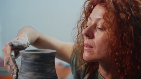 woman pottery artist at work