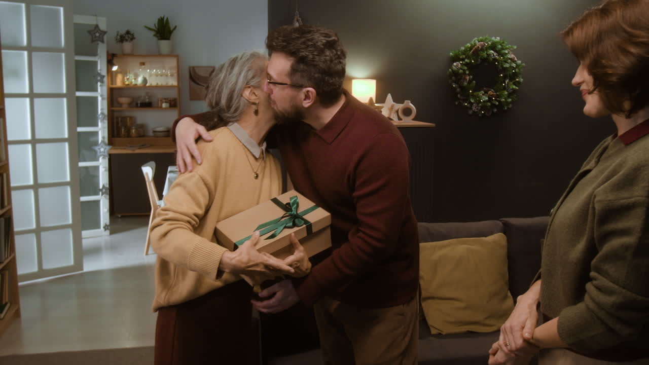 Family members exchanging Christmas gifts