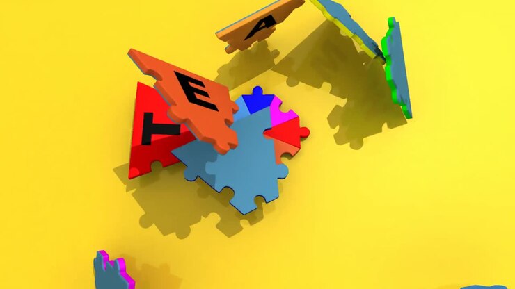 3d puzzle forming the word teamwork