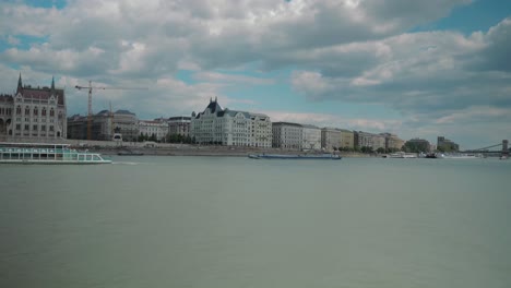 Boat-ride-through-Danube,-summer-afternoon,-leaving-budapest-parliament