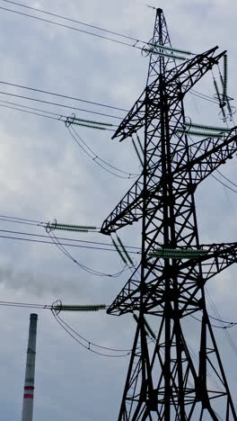 electricity transmission lines. high voltage transmission line with electric power wires. vertical video