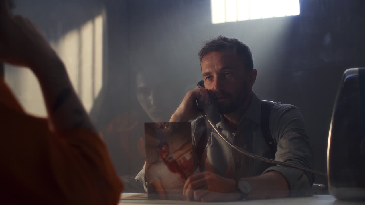 Investigator Showing Crime Scene Photo to Prisoner during Interrogation