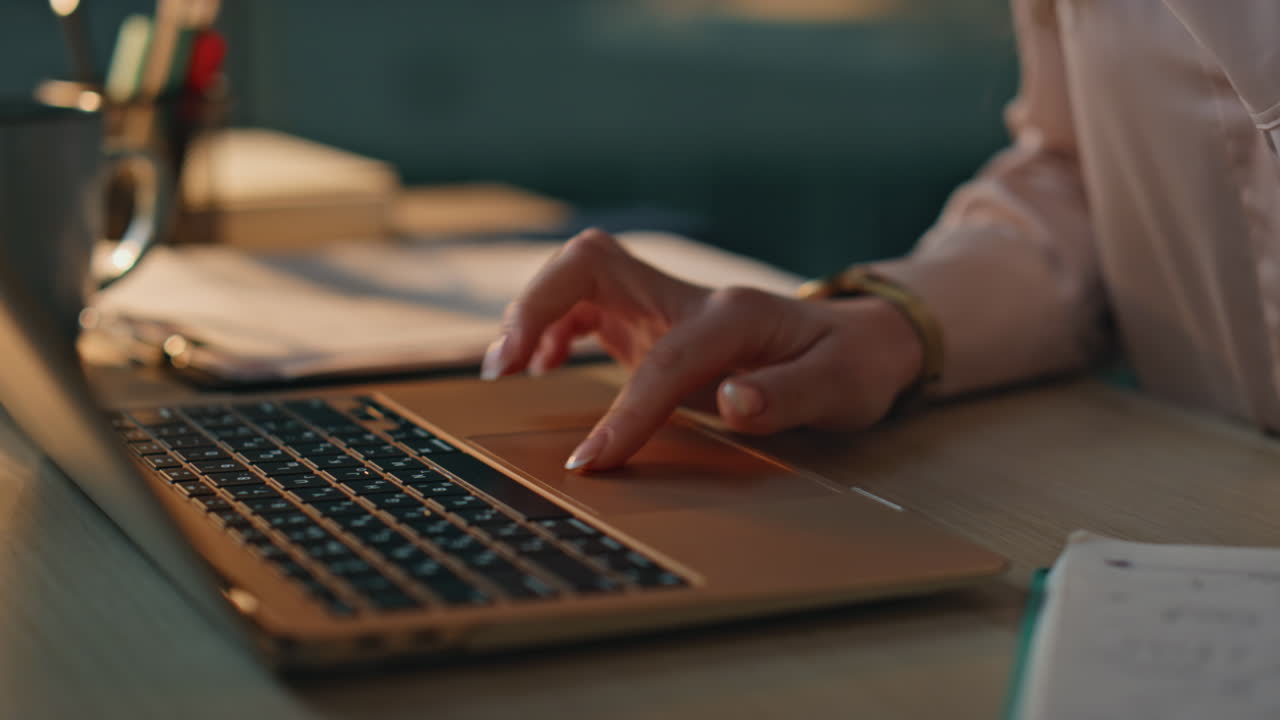 Closeup person taking notes at office desk. Businesswoman working on project