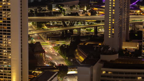timelapse of the singapore city skyline and traffic on the roads at night