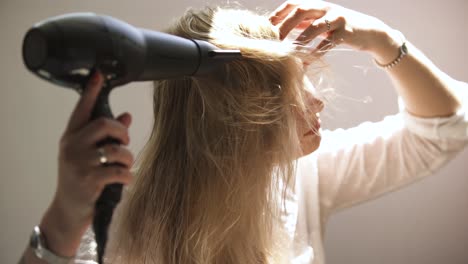 woman drying her hair