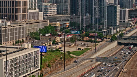 Atlanta-Georgia-Aerial-v881-traffic-hyperlapse,-birds-eye-view-flyover-interstate-freeway-and-overpass,-tilt-up-reveals-cityscape-across-midtown-and-downtown---Shot-with-Mavic-3-Pro-Cine---May-2023