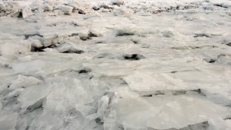 Aerial---Flying-over-the-frozen-ice-of-the-St-Lawrence-river