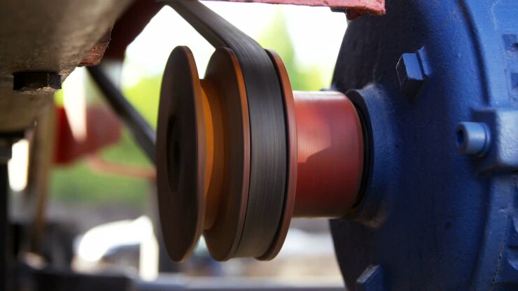 Red Detail Turns Round and Moves Belt on Equipment