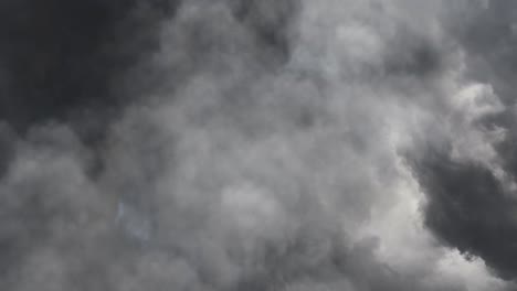 view of dark clouds and lightning strikes
