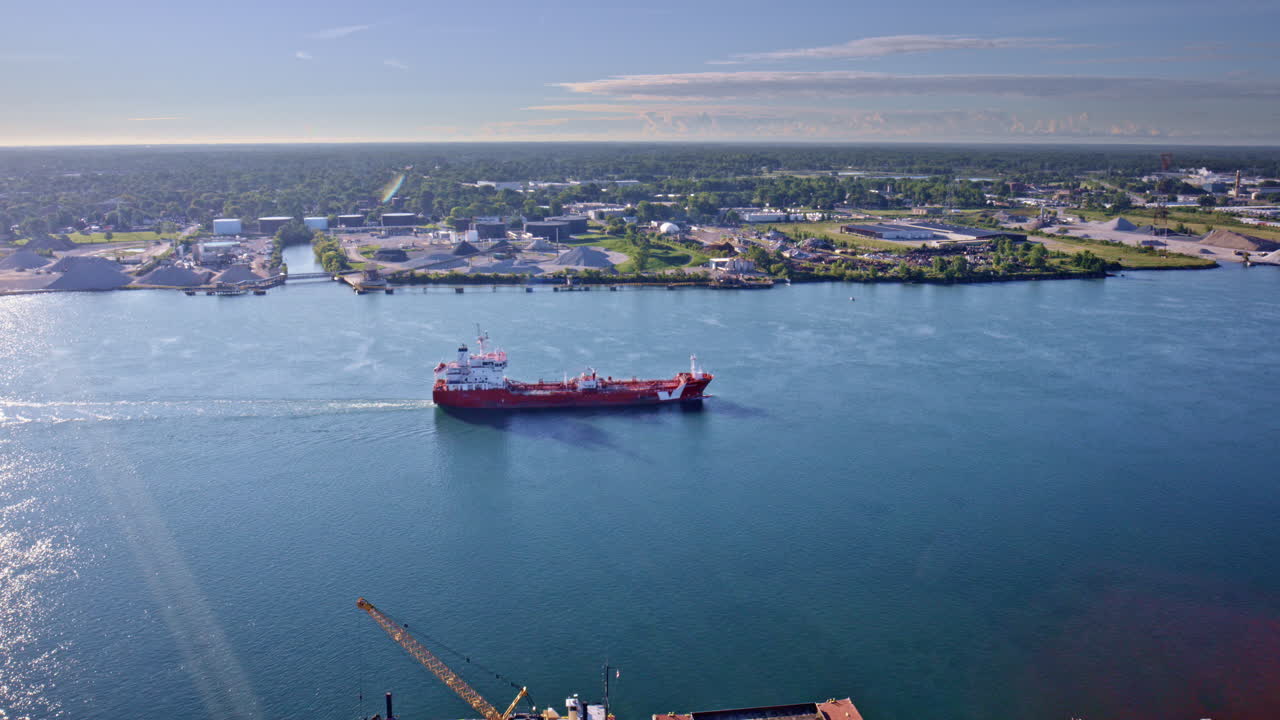 Drone camera capturing a wide, cinematic orbit around the border bridge linking the two nations