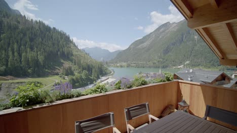 mountain lake views from wooden terrace balcony luxury alpine home push shot