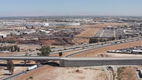 wide aerial dolly shot along the unfinished elevated track of the california high-speed rail in fresno, california. 4k