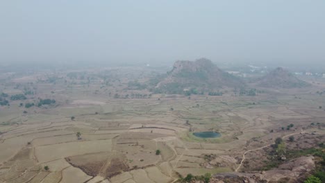 Drone-video-shot-of-vast-area-after-harvesting-in-plateau-region