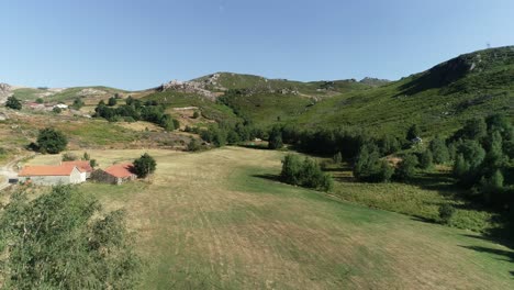 green fields and mountains aerial view