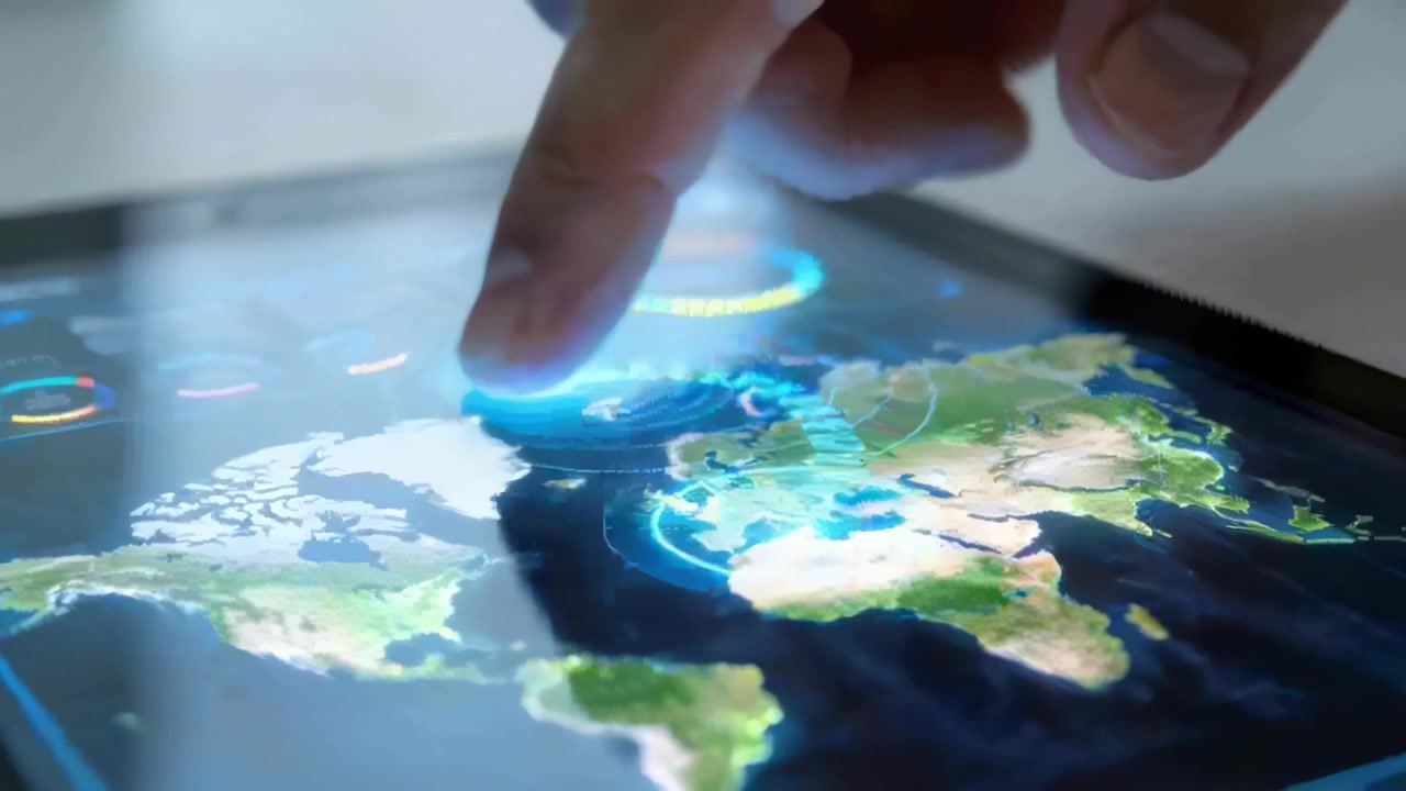 Tapping finger moving on tablet map at desk, revealing data via HUD rings, charts, copy space