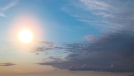 the bright sun on the beautiful blue sky background. time lapse