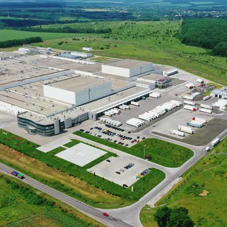 modern manufacture in nature. panoramic view of industrial territory among beautiful green environment. aerial view.