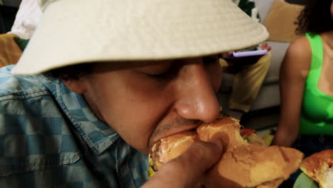 man enjoying fast food