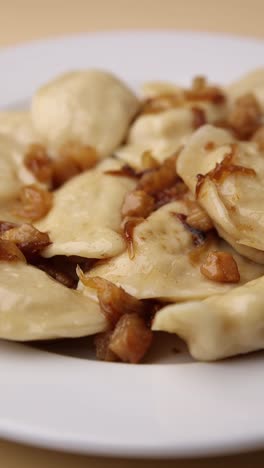 pierogi with onion sauce