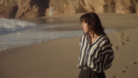 woman on a beach at sunset