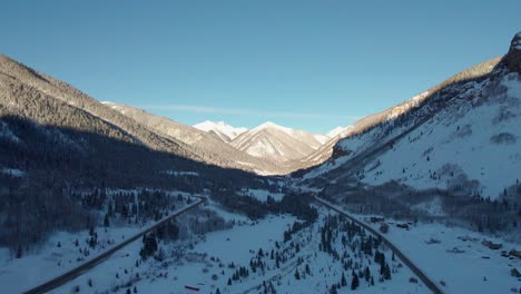 Aerial-view-of-a-distant-mountain-with-the-sunrise-hitting-it