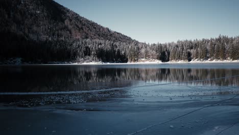 Discover-the-hidden-charm-of-a-lake-glimpsed-through-a-rustic-fence