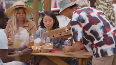 friends eating in the park