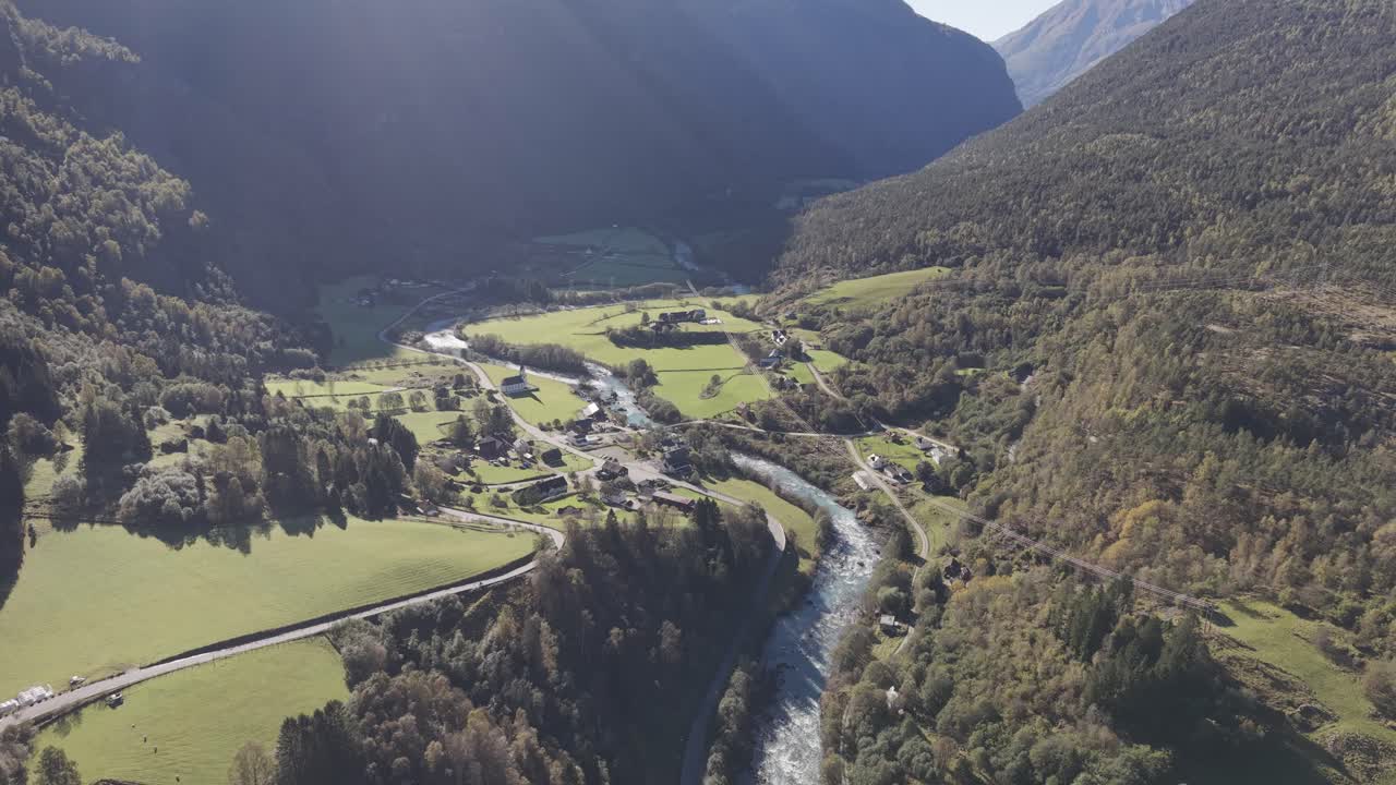 Areal footage of a beautiful valley with river and small town. Drone footage, Norway
