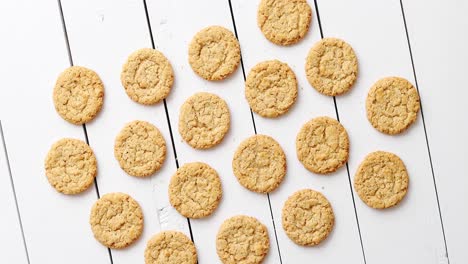 healthy oatmeal cookies on white wood background  top view