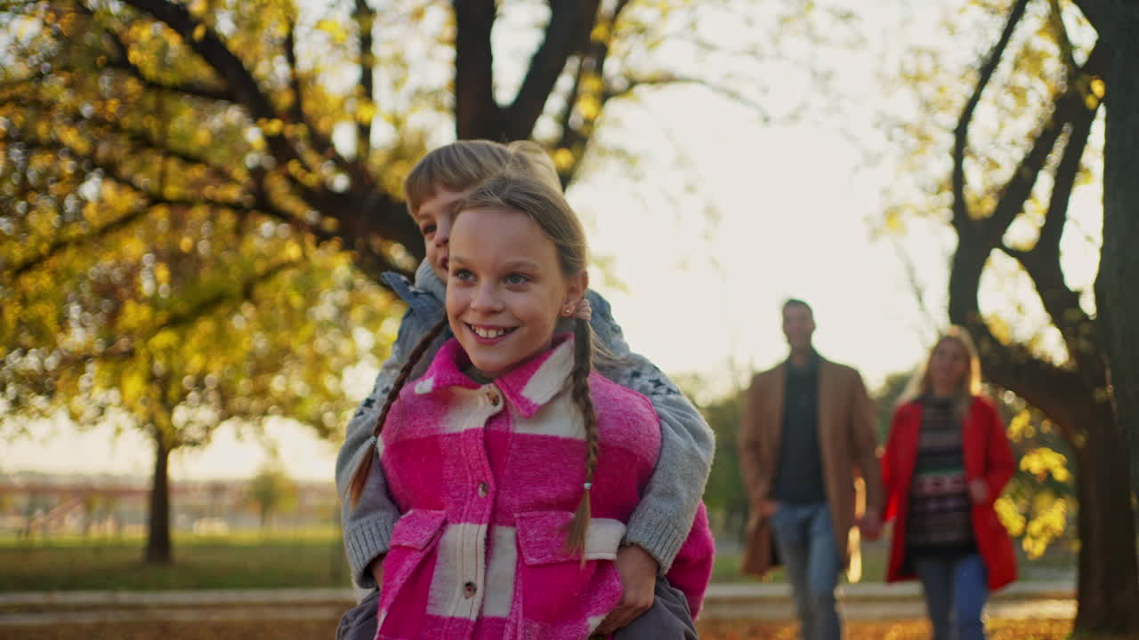 Family enjoying a day in the park during autumn