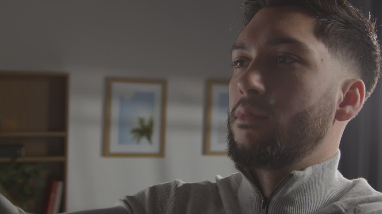 Young Man At Home Choosing Business Suit From Wardrobe For Job Interview 3